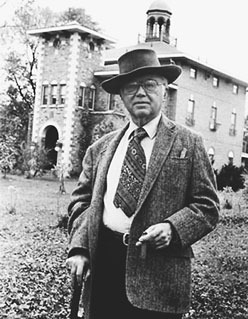 Russell Kirk in hat in front of Piety Hill