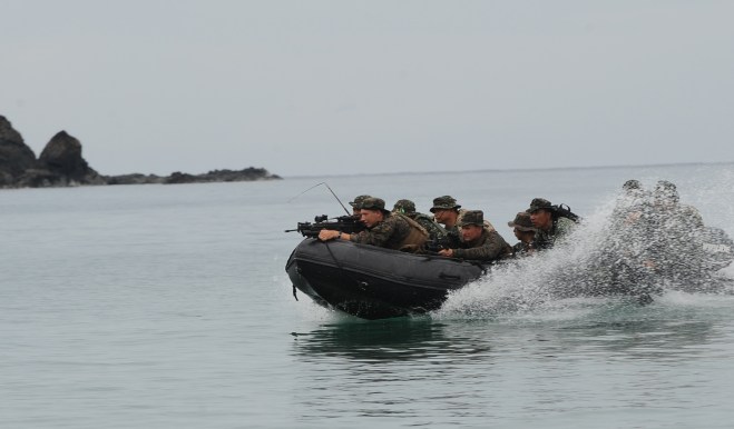 Philippine and US marines aboard a rubbe