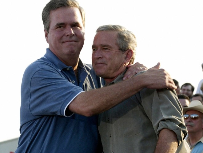 US President George W. Bush (R) is embra