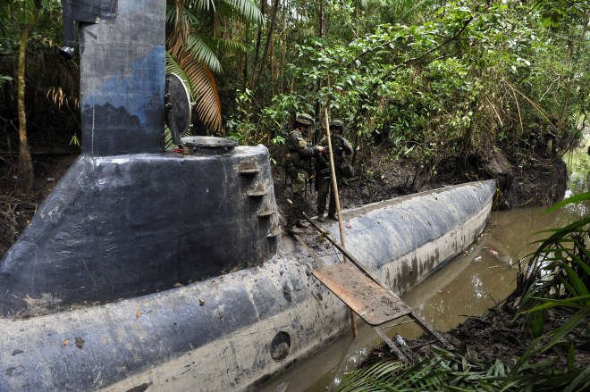 Colombian soldiers guard a homemade subm