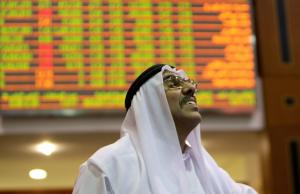An Emirati trader looks at the prices of