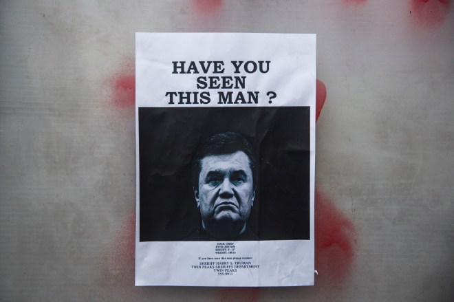 Arrest Warrant Issued For Former Ukrainian Leader As Square Becomes Shrine To Dead