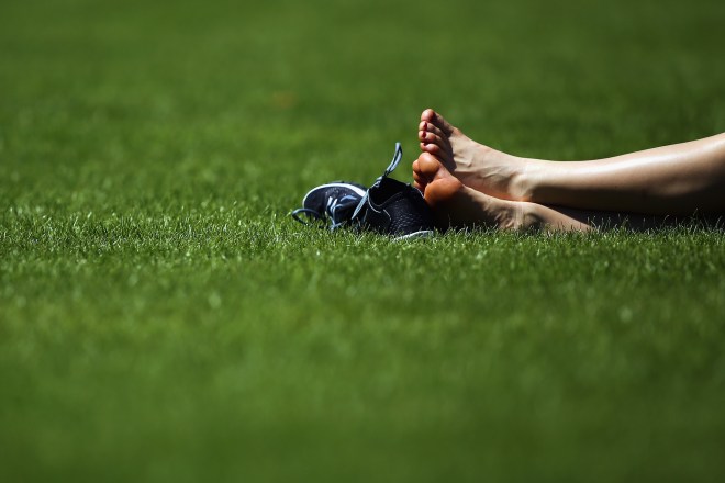 Members of the Public Relax In The Warm Weather In London