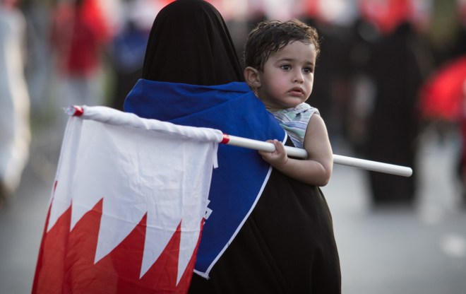 A woman with her child participates in a demonstration