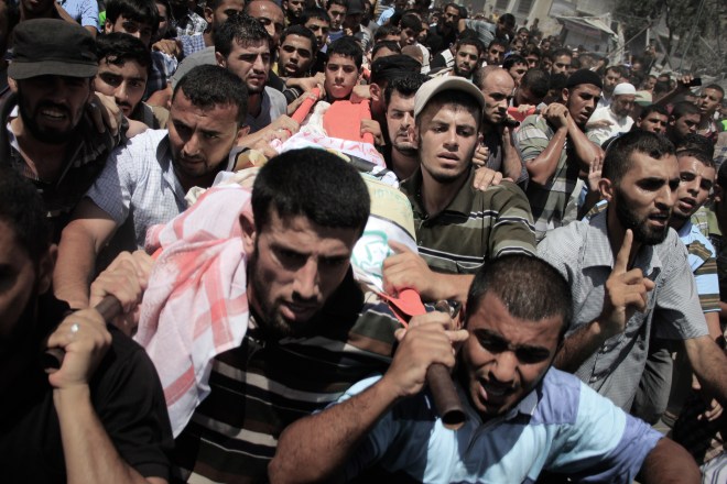 Palestinians carry the body of Mohammed Abu Shammala, one of