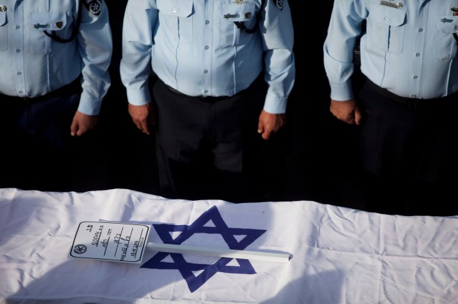 Mourners Attend The Funeral Of The Policeman Who Died In Synagogue Attack