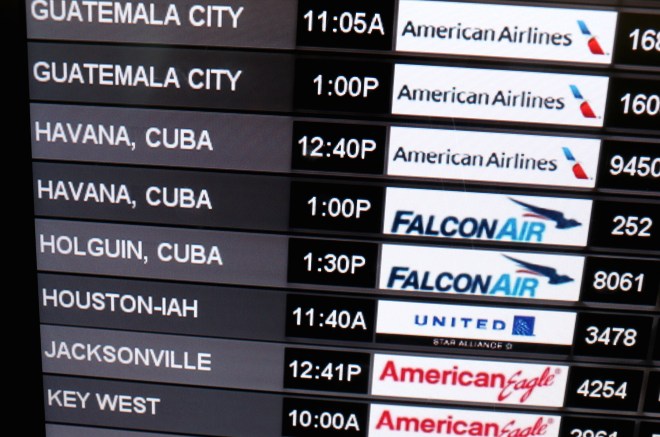 Travelers Check In To Flight To Havana, Cuba From Miami